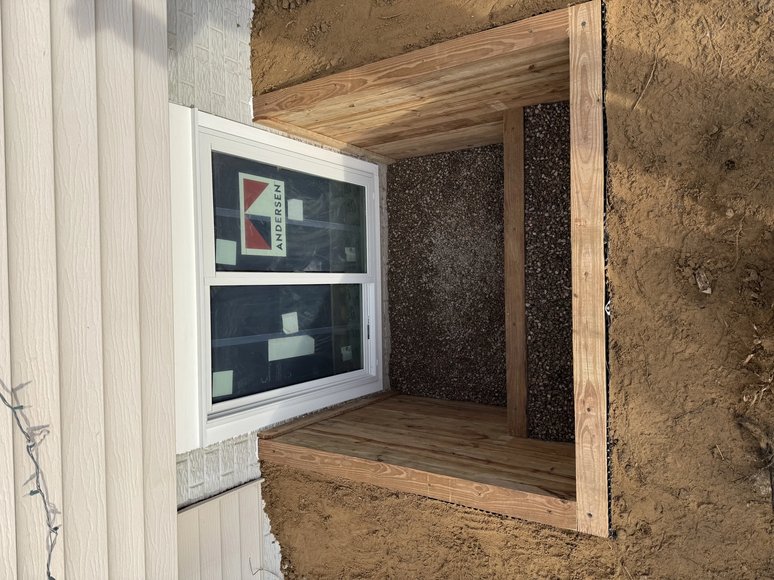 Garden timber tiered egress well example