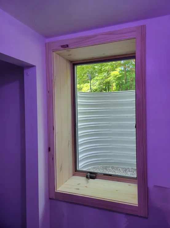Pine trim egress window interior finish